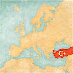 Turkey (Turkish flag) on the map of Europe. The Map is in vintage summer style and sunny mood. The map has soft grunge and vintage atmosphere, which acts as watercolor painting on old paper.