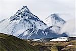 Nature of Kamchatka - beautiful volcanic landscape: view on Kamen Volcano, active Kliuchevskoi Volcano and active Bezymianny Volcano. Russia, Far East, Kamchatka.