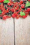 Fresh ripe berries on wooden table background with copy space
