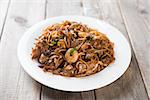 Fried Char Kuey Teow, popular noodle dish in Malaysia and Singapore.