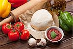 Pizza cooking ingredients. Dough, vegetables and spices