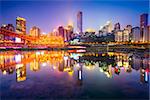 Chongqing, China riverside cityscape at night on the Jialing River.