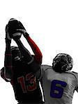 two american football players pass action in silhouette shadow on white background