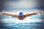 Professional man swimmer swims in open sea