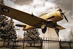 A vintage edit of an old historic war plane on display in a public park, located in Smiths Falls, Canada.