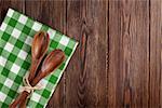 Kitchen cooking utensils over wooden table background. Top view with copy space