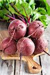 Bunch of beetroots on old wood background