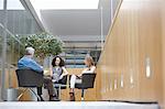 Businessman and women talking at conference room meeting