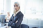 Portrait of young businesswoman wearing hijab in office