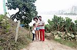 Portrait of couple and son on Ipanema beach, Rio De Janeiro, Brazil