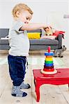 Boy playing with blocks at home