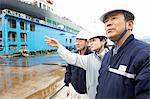 Workers having discussin at shipyard, GoSeong-gun, South Korea