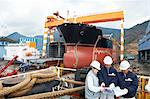 Workers discussing plans at shipyard, GoSeong-gun, South Korea