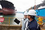 Workers having discussion at shipping port, GoSeong-gun, South Korea