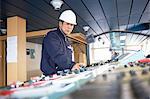 Worker using equipment at shipping port, GoSeong-gun, South Korea