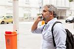 Man talking on cellphone in street, Rio de Janeiro, Brazil