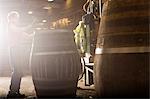 Young man making whisky cask in cooperage