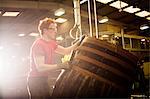 Young man working in cooperage