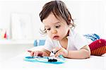 Baby boy playing on floor