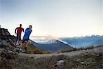 Two mature men trail running, Valais, Switzerland