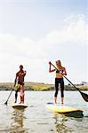 Couple and toddler daughter standup paddleboarding, Carlsbad, California, USA