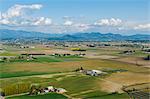 Aerial view of valley fields and distant mountains