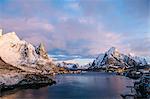 Coastline and snow-capped mountains, Reine, Norway