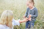 Mother with girl on meadow