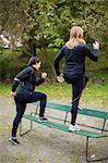 Young women training on bench