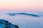 Clouds above mountains at dawn