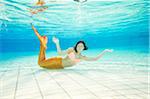 Portrait of Teenage Girl with Mermaid Tail Underwater