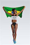 Female Athlete Holding a Brazilian Flag