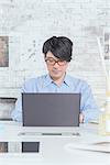 Japanese man working in modern office