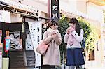 Young Japanese women enjoying trip in Kawagoe, Japan