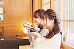 Young Japanese women enjoying Maccha green tea in Kawagoe, Japan