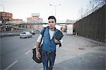 Young man in the street, Milan, Italy