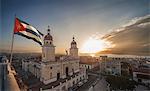 Cuban flag over Plaza de la Cathdral at sunset, Santiago de Cuba, Cuba