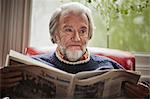 Senior man reading newspaper