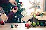 Person decorating christmas tree