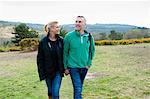 Hiking couple walking in rural landscape