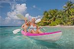 Senior couple in canoe, Maldives