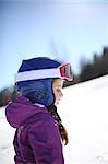 Portrait of a 5 years old little girl in the mountains, in winter