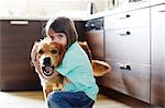 Girl playing with a dog