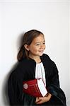 Little girl wearing a black robe as a judge