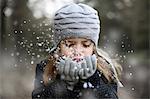 Girl holding snow in her hands