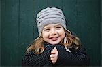 Portrait of a little girl wearing a woolly hat