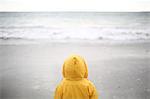 3 years old boy looking at the sea