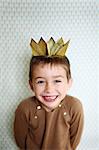 6 years old boy wearing a king crown
