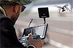 France,Côte d'Or. Dijon. Man piloting a surveillance drone / shots.