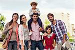 Family posing for group portrait outdoors